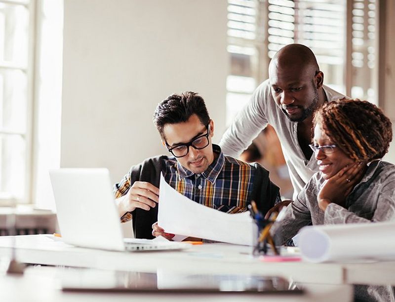 Three people collaborating together